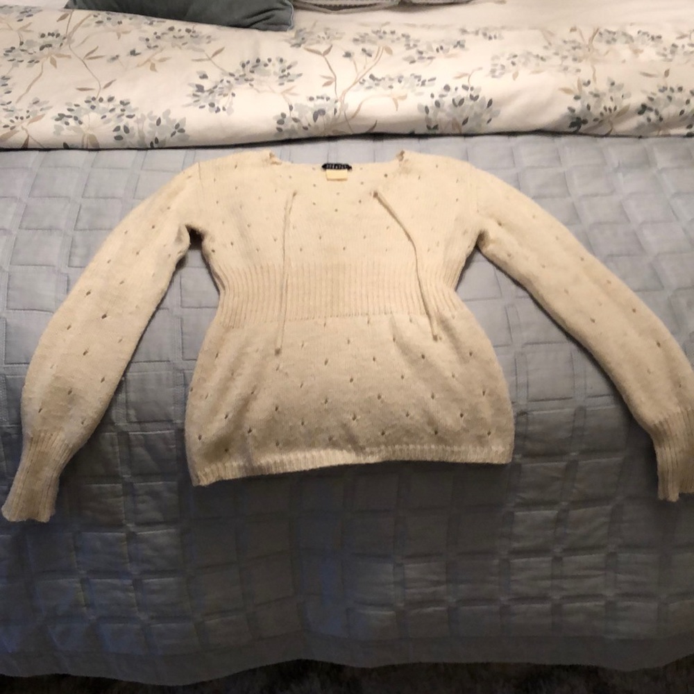 A cream wool sweater
